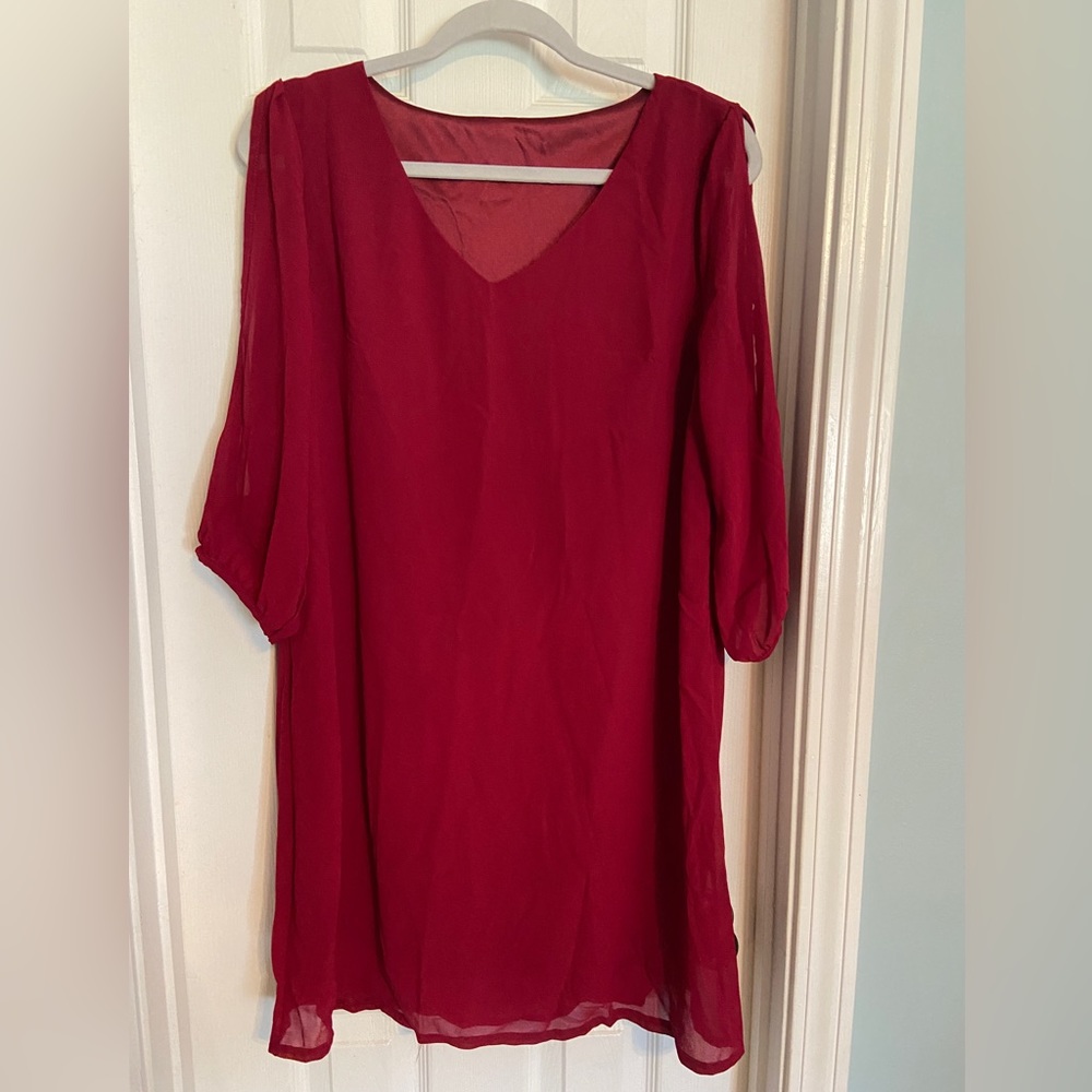 Red mini dress, long sleeves, straight lines never been worn.
